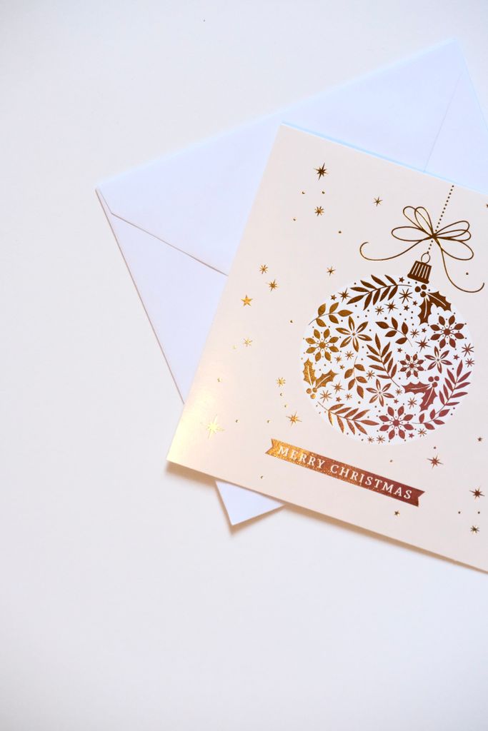 A stylish Christmas card featuring a decorative bauble design and 'Merry Christmas' text, ideal for holiday greetings.